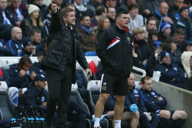 Karl Robinson and Richie Barker give orders from the sidelines.
