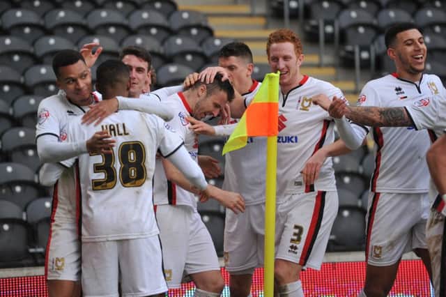 MK Dons celebrate Milton Keynes Dons midfielder Antony Kay(6) scoring goal to go 1-0 up  during the Sky Bet Championship match between Hull City and Milton Keynes Dons at the KC Stadium, Kingston upon Hull, England on 12 March 2016. Photo by Ian Lyall. PNL-161203-164531002