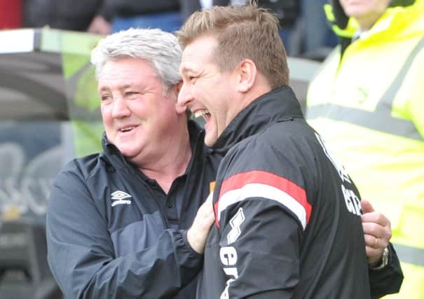 Hull City manager Steve Bruce(left) and Milton Keynes Dons Manager Karl Robinson during the Sky Bet Championship match between Hull City and Milton Keynes Dons at the KC Stadium, Kingston upon Hull, England on 12 March 2016. Photo by Ian Lyall. PNL-161203-164620002