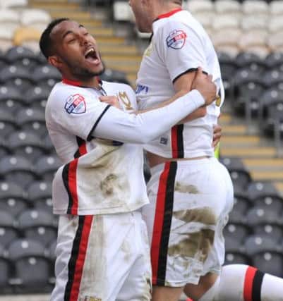 Milton Keynes Dons forward, on loan from Bolton Wanderers, Rob Hall(38) celebrates with Milton Keynes Dons midfielder Antony Kay(6) who scored to go 1-0 up during the Sky Bet Championship match between Hull City and Milton Keynes Dons at the KC Stadium, Kingston upon Hull, England on 12 March 2016. Photo by Ian Lyall. PNL-160313-162339002