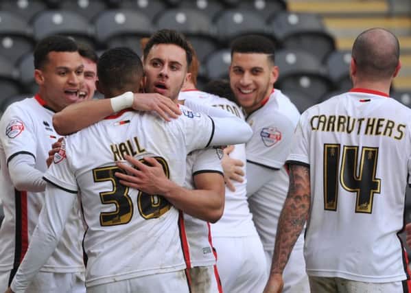 MK Dons celebrate Milton Keynes Dons midfielder Antony Kay(6) scoring goal to go 1-0 up  during the Sky Bet Championship match between Hull City and Milton Keynes Dons at the KC Stadium, Kingston upon Hull, England on 12 March 2016. Photo by Ian Lyall. PSI-1701-0018