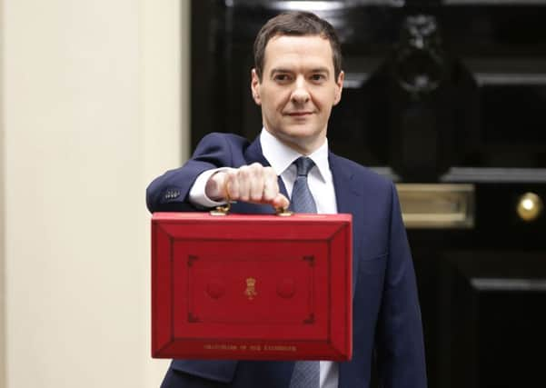 The Chancellor of the Exchequer George Osborne outside No 11 Downing Street, London, before delivering the Budget Statement in the House of Commons: Yui Mok/PA Wire