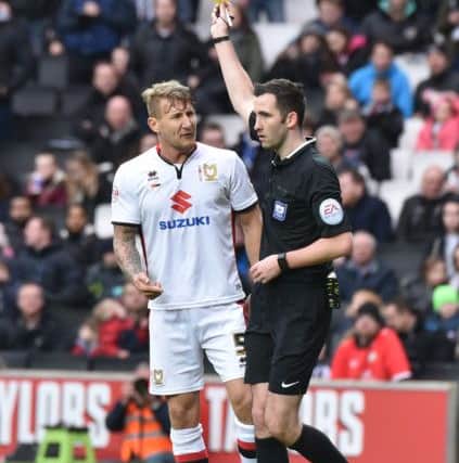 Kyle McFadzean had been booked for his involvement in a scuffle with Brighton keeper David Stockdale a minute before being sent off.