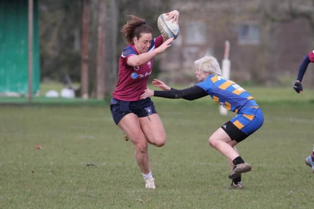 Caroline Collie dodges a tackle