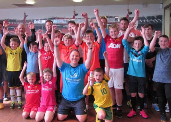 Charity champion Richard Banks and his footie supporters