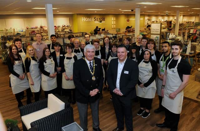 Milton Keynes Mayor Cllr Keith McLean and Darren Sams (Store manager) with staff before the opening of the store