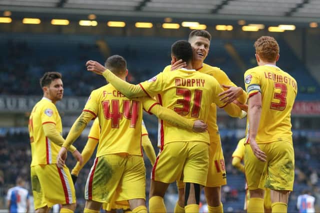 MK Dons celebrate MK Dons forward Alex Revell (18)  goal during the Sky Bet Championship match between Blackburn Rovers and Milton Keynes Dons at Ewood Park, Blackburn, England on 27 February 2016. Photo by Simon Davies. PSI-1619-0095