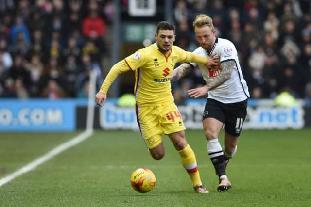 MK Dons forward Jake Forster-Caskey    battles with Derby County striker Johnny Russell during the Sky Bet Championship match between Derby County and Milton Keynes Dons at the iPro Stadium, Derby, England on 13 February 2016. Photo by Jon Hobley. PSI-1557-0012
