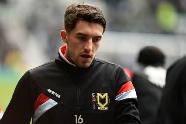 MK Dons defender Joe Walsh warms up ahead of the Sky Bet Championship match between Derby County and Milton Keynes Dons at the iPro Stadium, Derby, England on 13 February 2016. Photo by Jon Hobley. PSI-1557-0054