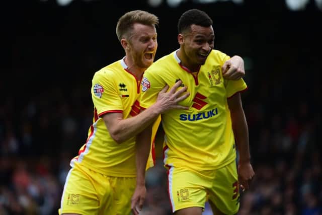 MK Dons Josh Murphy celebrates scoring an equaliser during the Sky Bet Championship match between Fulham and Milton Keynes Dons at Craven Cottage, London, England on 2 April 2016. Photo by Jon Bromley. PNL-160204-164308002