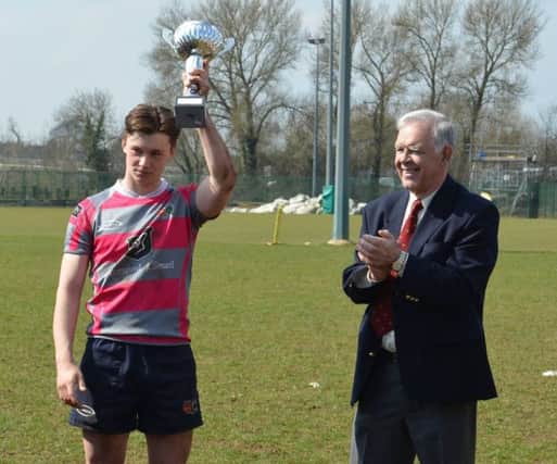 Harry Warn receives the Midlands Cup from the RFU representative (Pic: Jeff Bowden)