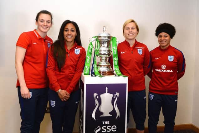 BURTON-UPON-TRENT, ENGLAND - APRIL 05: Rachel Laws of Sunderland, Alex Scott of Arsenal, Gilly Flaherty of Chelsea and Demi Stokes of Manchester City semi-Finalists of the SSE Women's FA Cup pose with the SSE Women's FA Cup during the England Women Training Session at St Georges Park on April 5, 2016 in Burton-upon-Trent, England.  (Photo by Tony Marshall/Getty Images)