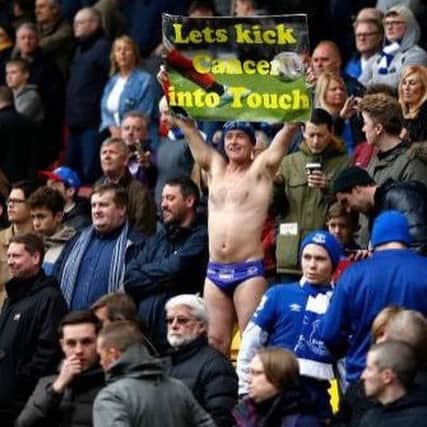 Michael in the stands at one of Everton's games
