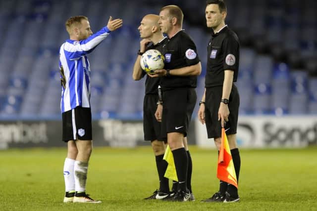 Barry Bannan with the referee at full time PNL-160419-223750002