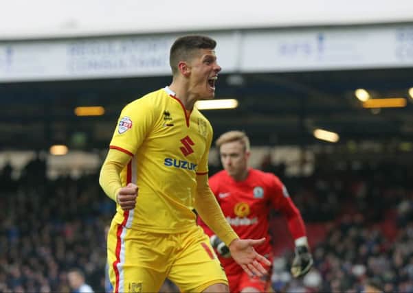 MK Dons forward Alex Revell (18) scores for MK Dons  during the Sky Bet Championship match between Blackburn Rovers and Milton Keynes Dons at Ewood Park, Blackburn, England on 27 February 2016. Photo by Simon Davies. PSI-1619-0056