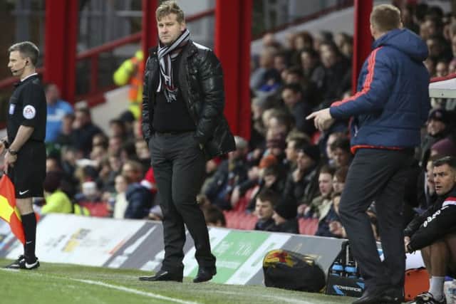 Milton Keynes Dons manager Karl Robinson not looking to impressed with the first half performance during the Sky Bet Championship match between Brentford and Milton Keynes Dons at Griffin Park, London, England on 5 December 2015. Photo by Matthew Redman. PSI-1245-0015