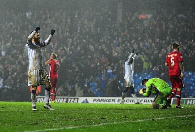 Leeds players celebrate Antony Kay's own goal. YPN-160201-182340049