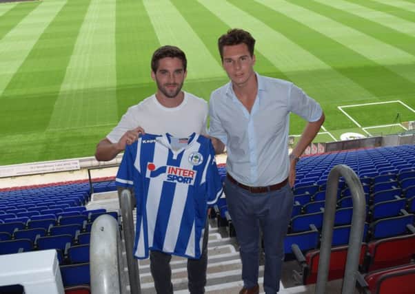 Will Grigg signs for Wigan