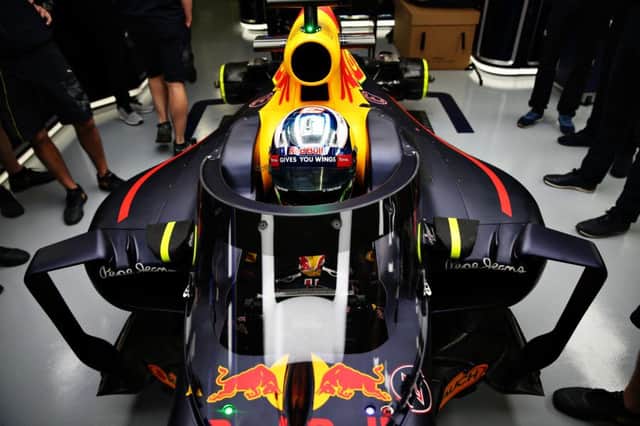 Daniel Ricciardo sat behind the wheel of the RB12 with the canopy windscreen