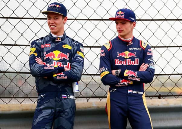 Max Verstappen (right) will replace Daniil Kvyat at Red Bull Racing.