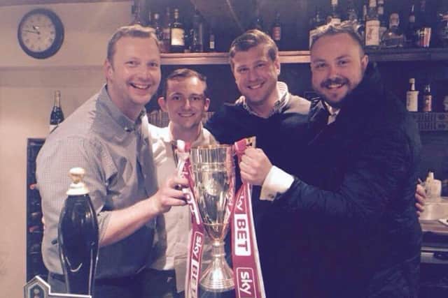 Dave Pugh and Alan Ayres with MK Dons manager Karl Robinson last year
