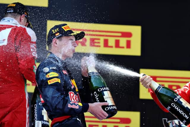 Max Verstappen tastes victory champagne in Spain