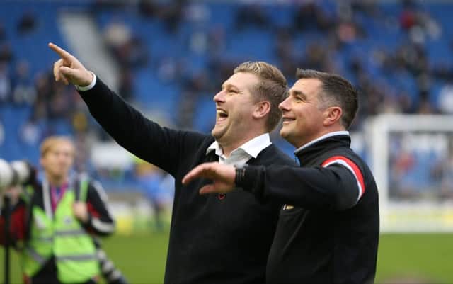 Milton Keynes Dons manager Karl Robinson and Milton Keynes Dons head of coaching Richie Barker during the Sky Bet Championship match between Brighton and Hove Albion and Milton Keynes Dons at the American Express Community Stadium, Brighton and Hove, England on 7 November 2015. PSI-1118-0002
