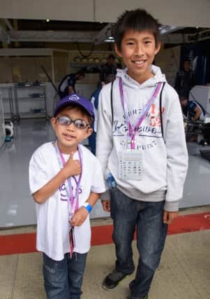 Johnathan with his brother at Silverstone