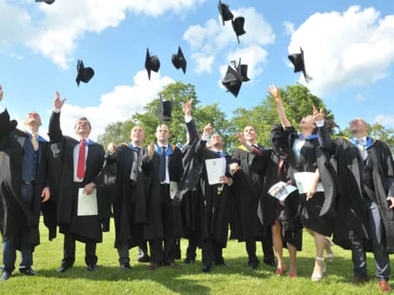 Graduates celebrate their degrees