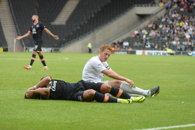 Shani Tarashaj came off second best in a clash with Dean Lewington