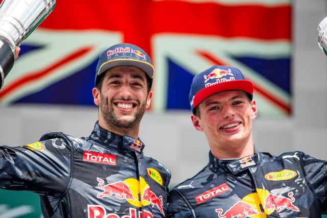 Daniel Ricciardo and Max Verstappen celebrate on the podium in Germany