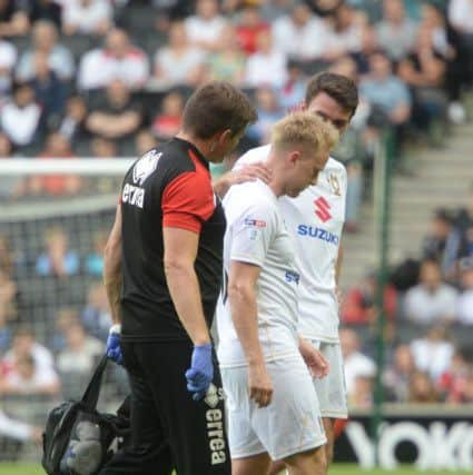 Ben Reeves limps off against Everton