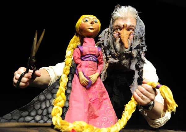 Story-teller Andy Lawrence, from the Theatre of Widdershins, is pictured alongside some of the characters from Rapunzel and the Tower of Doom. Picture: Jane Barlow
