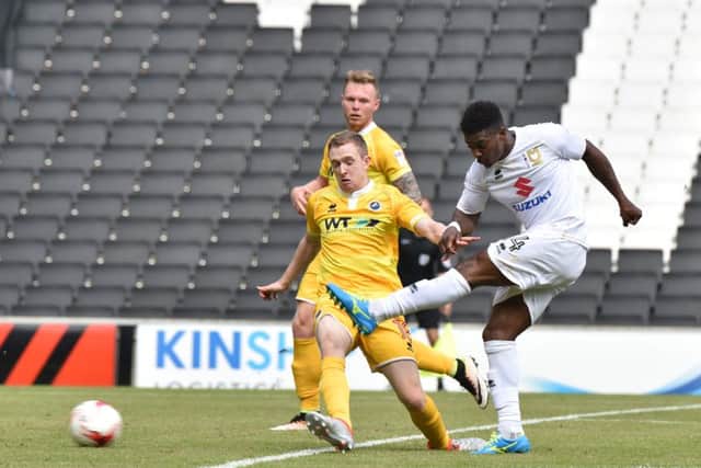 Kieran Agard's low drive pulled one back for MK Dons