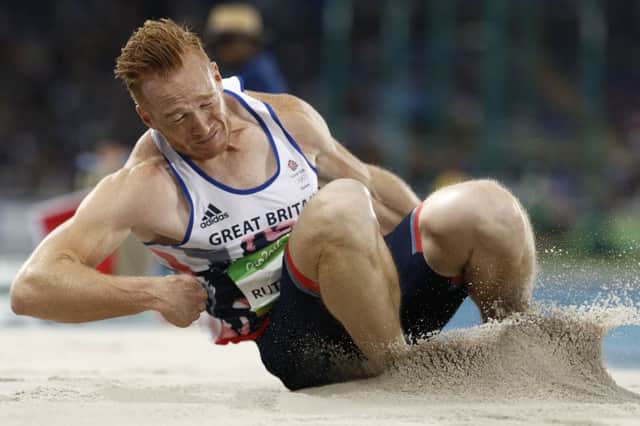 Britain's Greg Rutherford competes in the Men's Long Jump Final during the athletics event at the Rio 2016 Olympic Games at the Olympic Stadium in Rio de Janeiro on August 13, 2016.   / AFP / Adrian DENNIS        (Photo credit should read ADRIAN DENNIS/AFP/Getty Images) 631448163