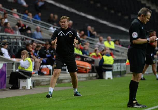 Karl Robinson will need to work hard on deadline day PNL-160827-225400002