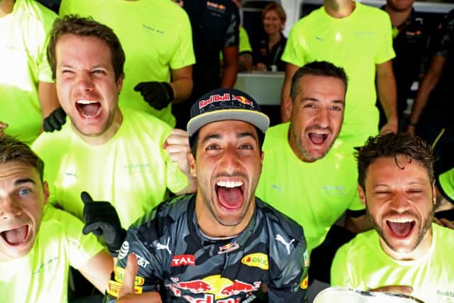 Daniel Ricciardo celebrates with his crew