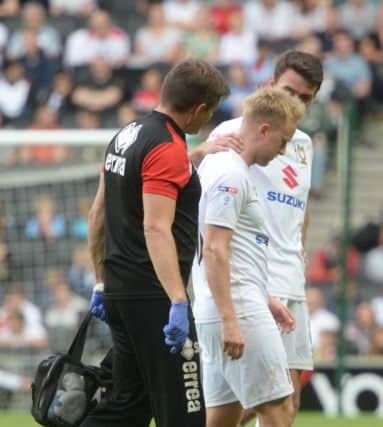 Ben Reeves limps off against Everton