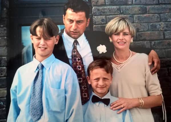 Loving Milton Keynes family: Thomas Morris pictured  as a boy with dad Ralph, mum Jacqueline and younger brother Joseph.