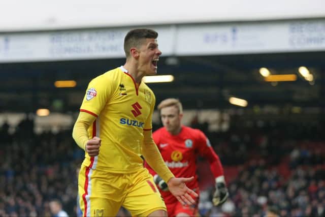 Alex Revell celebrated for MK Dons last season and will do the same if he scores against them for Northampton on Sunday. (Pic: PSI)