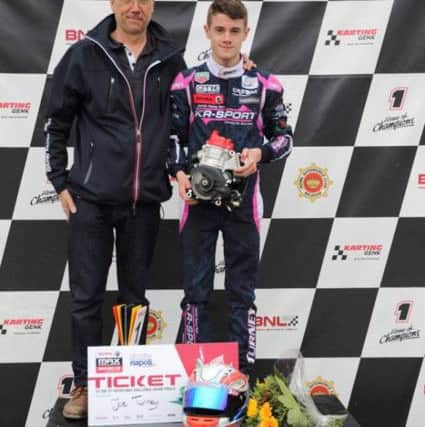 Joe on the podium with his dad