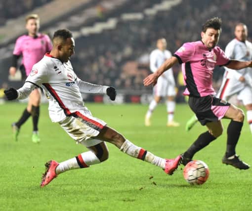 Rob Hall in action for MK Dons last season