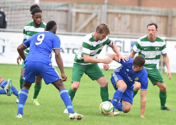 Dan Banister is on the floor during Peterborough Sports' win in the top-of-the-table United Counties Premier Division clash with Newport Pagnell at PSL. Photo: David Lowndes.