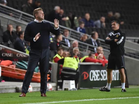 Karl Robinson will be sticking to his guns