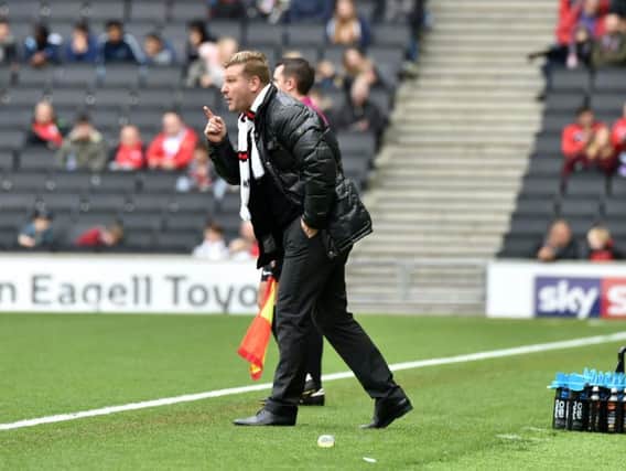 MK Dons boss Karl Robinson watches his team lose 3-0 to Southend (Picture: Jane Russell)