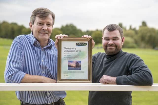 Peter Watson is presented with his certificate by David Foster, Chief Executive of The Parks Trust