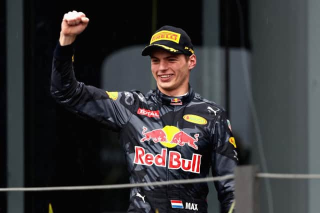 SAO PAULO, BRAZIL - NOVEMBER 13:  Max Verstappen of Netherlands and Red Bull Racing celebrates finishing in third place on the podium during the Formula One Grand Prix of Brazil at Autodromo Jose Carlos Pace on November 13, 2016 in Sao Paulo, Brazil.  (Photo by Mark Thompson/Getty Images) // Getty Images / Red Bull Content Pool  // P-20161113-01141 // Usage for editorial use only // Please go to www.redbullcontentpool.com for further information. //