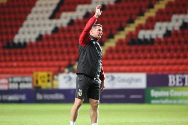 Richie Barker waves goodbye to the MK Dons fans