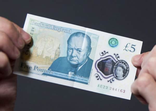 Brits are being urged to check their new fivers after engraved bank notes worth as much as Â£50,000 were circulated in a Willie Wonka-style 'Golden Ticket' giveaway.