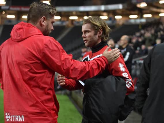Robbie Neilson got the better of former Dons boss Karl Robinson.